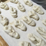 Dough formed for deep frying in a tie shape