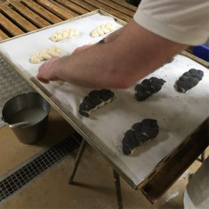 Zopfkuchen being completed with poppy seeds at Bakery Roth in Erfurt