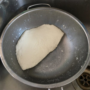 Mozzarella in colander before being stretched