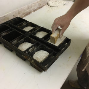 Spelt Bread Loaf being pressed into form before baking